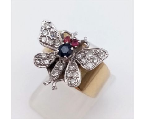 A Beautiful 14K Yellow Gold Diamond, Sapphire and Ruby Butterfly Ring. 0.30ct. Size N. 8.6g.