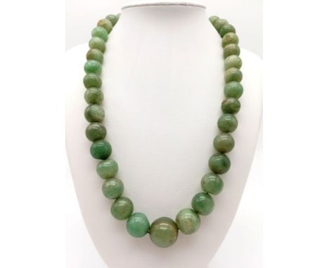 A Vintage Chinese 500ct Celadon Jade Graduated Bead Necklace. Largest central bead - 18mm diameter. Screw barrel clasp. The n