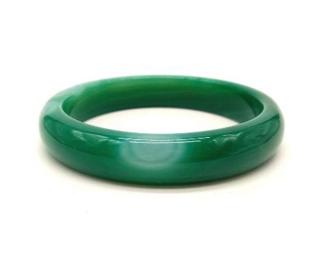 A Green Jade Bangle. 6.5cm inner diameter. 