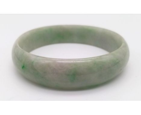 A Green Jade Bangle - 6.5cm inner diameter. 