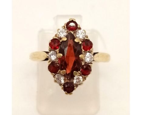 A 9K Yellow Gold Ruby and Diamond Cluster Ring. Size M.2.9g 