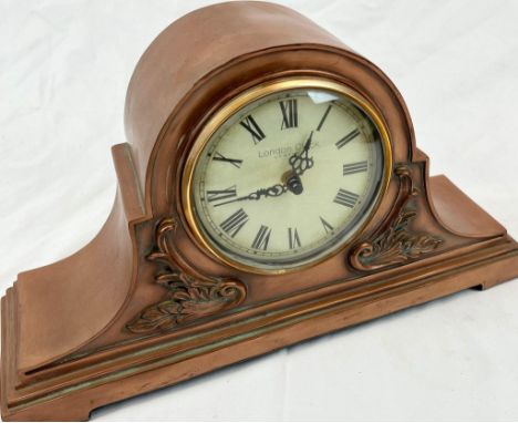 A modern copy of an antique copper over mantle clock marked London Clock Company. Dimensions: 40 x 12 x 22 cm. Quartz movemen