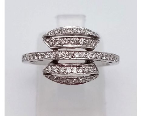 An 18 K white gold ring with five rows of diamonds. Ring size: N, weight: 3.7 g. 