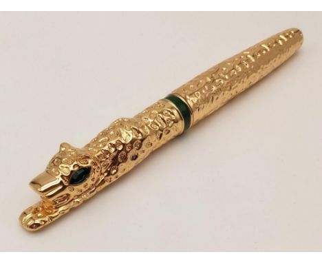 A heavy, luxuriously 18 K yellow gold plated pen in the style of Cartier Panther. In a presentation box. Excellent/ unused co