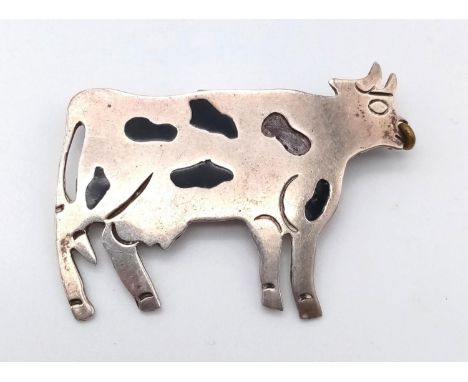 An Early Silver and Enamel Cow Pendant. 5 x 3.5cm.10g 