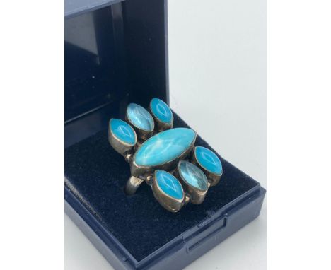 Vintage silver ring 1960/70?s Having turquoise coloured stones set to top. Large statement piece of jewellery. Complete with 