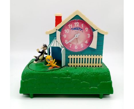 A Vintage Tweety Talking Alarm Clock. In working order but the talking part is temperamental so A/F. 21 x21cm. 