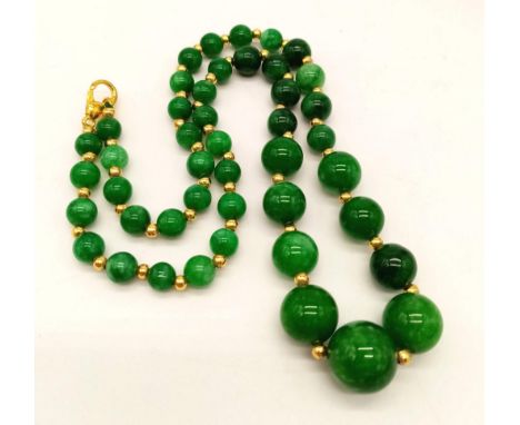 A Graduated Jade Bead Necklace. 44cm 