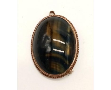 A Vintage 9K Yellow Gold Tigers Eye Brooch. 4cm.13g total weight. 
