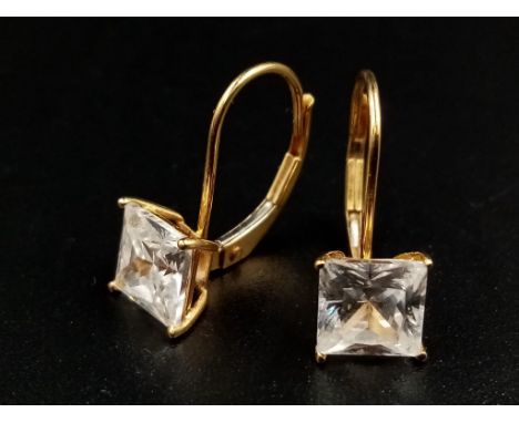 A 14 K yellow gold pair of earrings with square cubic zirconia. 