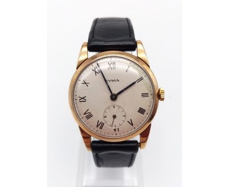 A Vintage Cyma Gents Wrist Watch. Black leather strap with gold-plated case - 32mm. Secondary second dial. Mechanical wind-up