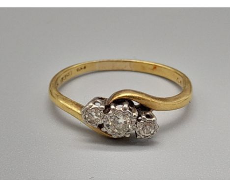 An 18K Yellow Gold Three-Stone Diamond Ring. 0.15ct. Size K. 2.1g. 