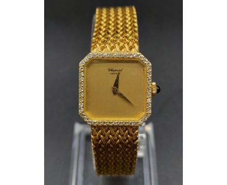 A Chopard 18K Gold and Diamond Ladies Watch. 18K gold strap and case - 20mm. Diamond bezel. Gold dial. Mechanical movement. 5