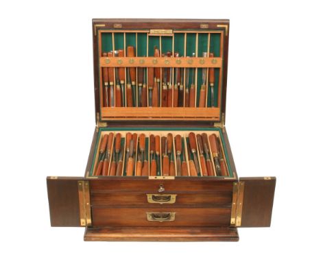A fine and little used set of 104 carving tools by ADDIS with polished mahogany handles contained in a superb quality, lockab