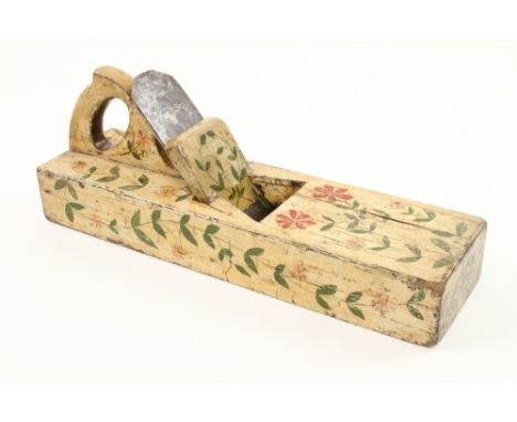 A 19c oak bench plane 19" x 5 1/2" made in two halves, found in the South of France and decorated o/a with pink and red flowe