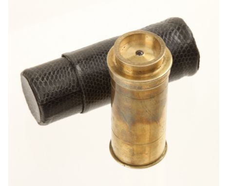 A small 3" portable brass microscope, the sample is placed inside the screw top and viewed to the light, high magnification, 