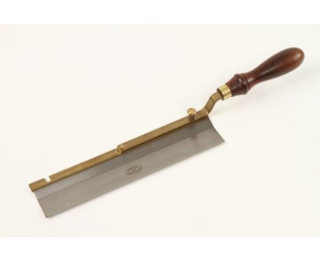 An unused gentleman's adjustable 10" brass back saw with rosewood handle by CROWN TOOLS Sheffield, the cranked handle can be 