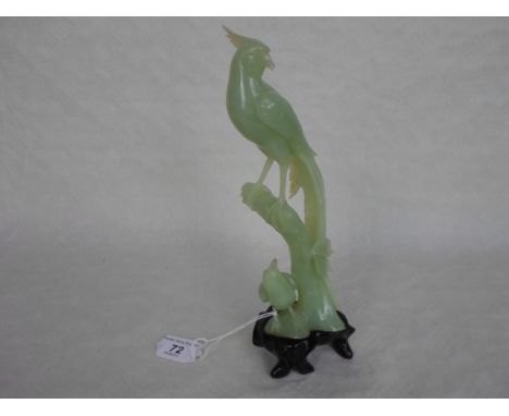 A carved Celadon jade study of two bird, 25cm, on bespoke wooden stand.