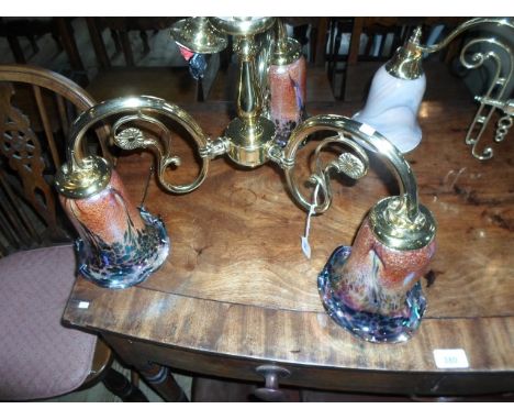 A gilt brass three branch ceiling light, having lustre shades, 38cm high.