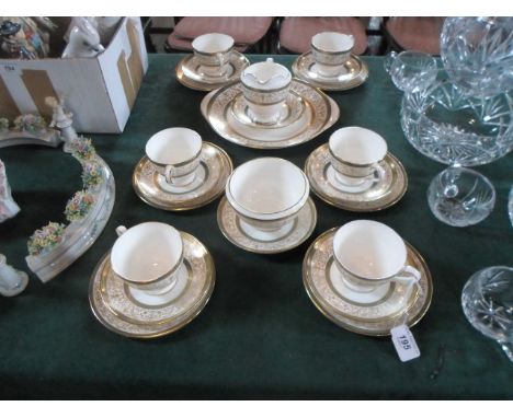 A Minton Aragon patter part-tea service, comprising: six trios, milk jug, open surgar bowl and sandwich plate.   Condition Re