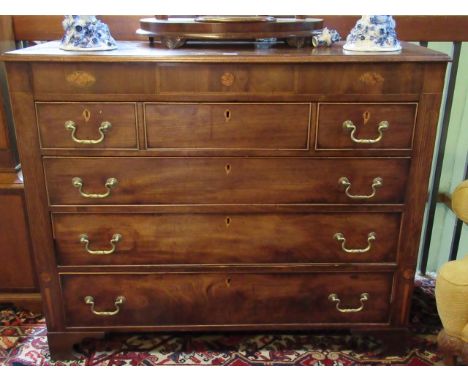 An early 19th century mahogany and inlaid chest, having four graduated drawers on bracket feet, 122cm wide.   Condition Repor