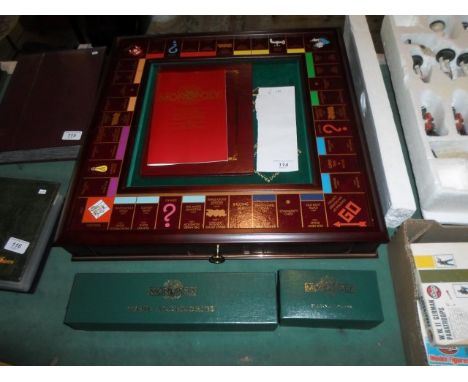 A De-Luxe Monopoly Collector's edition set, the board formed as a mahogany box with fitted drawer, with green velvet lining, 
