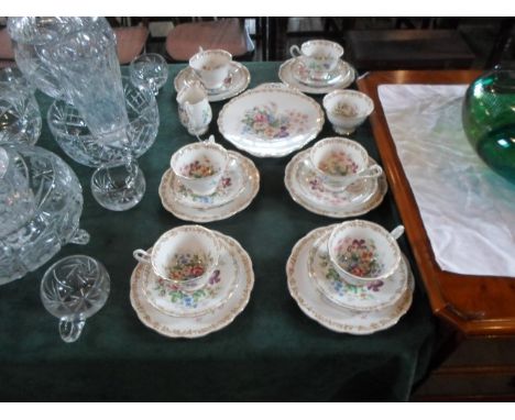 A Royal Albert Nosegay pattern part-tea service, comprising: six trios, open sugar bowl, milk jug and sandwich plate, having 