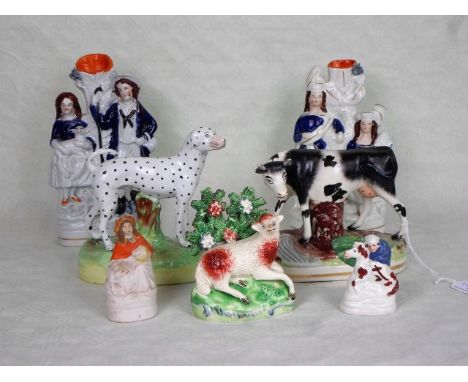 A collection of seven Staffordshire ceramic figures, to include: animals, a pair of stem vases and others, the tallest 22cm.