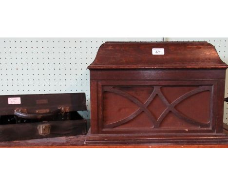 An early 20th century HMV oak cased gramophone, together with a cased early 20th century typewriter.