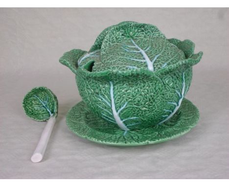A Portuguese ceramic tureen, formed as cabbage leaves, 26cm diameter.