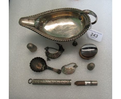 A Georgian silver pap boat, later converted to sauce boat on three pad feet, together with a silver caddy spoon, thimble, dec