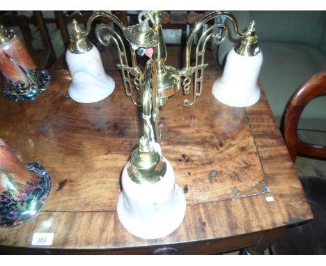A contemporary gilt brass three branch ceiling light, having marble effect shades, 35cm high.