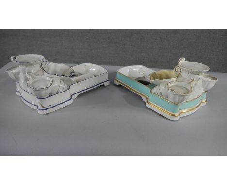 Two large 19th century ceramic seashell design graduated bathroom stands. H.20 W.43cm (Largest) 