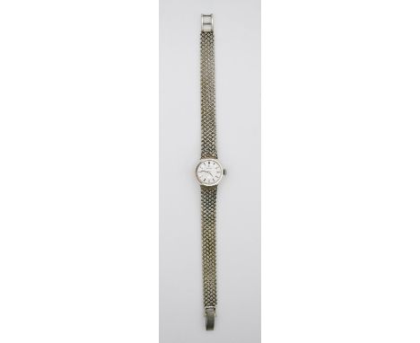 A lady's Omega 9 carat white gold manual wind vintage wrist watch, the silver dial with applied baton hour markers, pencil ha