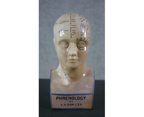 A ceramic phrenology head by L.N. Fowler. H.29 W.13 D.9cm 