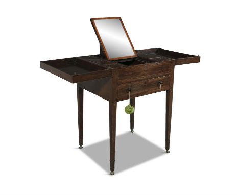 A 19TH CENTURY MAHOGANY FOLD OUT DRESSING TABLE, of compact rectangular shape, the cross-banded top enclosing fielded compart