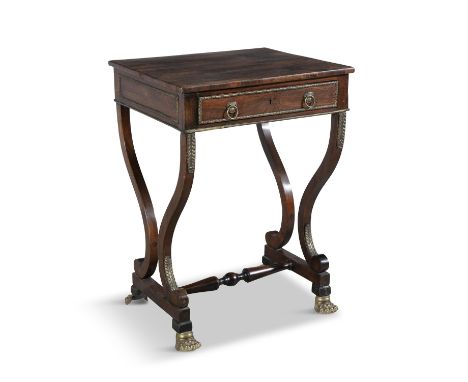 A REGENCY ROSEWOOD AND GILT METAL MOUNTED COMPACT WORK TABLE, the figured rectangular top over a single long drawer, on oppos