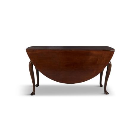 AN IRISH GEORGIAN MAHOGANY DOUBLE DROP LEAF TABLEextending to an oval shape, the solid panel top with moulded edge, over a si