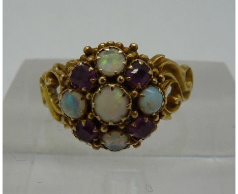 A Victorian 15ct gold, opal and ruby ring, Birmingham 1899, weight 2.5g, size L