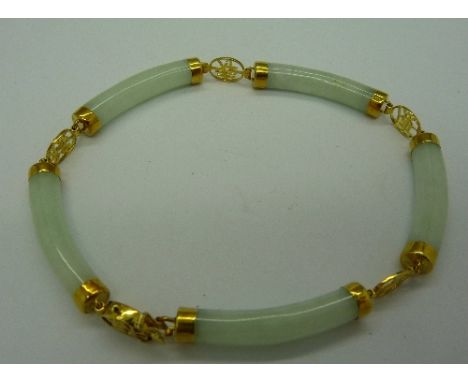 A 14ct gold mounted jade bracelet