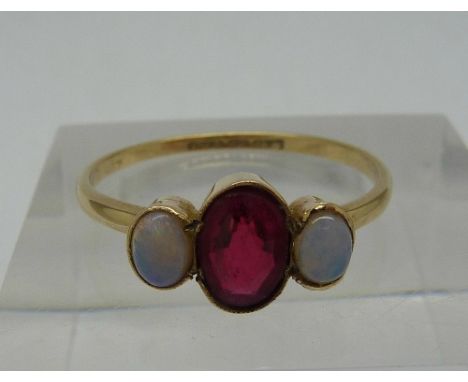 A 9ct gold, opal and red stone ring, weight 1.4g, size O