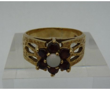 A 9ct gold, garnet and opal ring, weight 4.4g, size Q