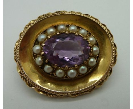 A 9ct gold, seed pearl and amethyst brooch/pendant, weight 10.1g