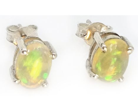 Pair of natural opal silver stud ear-rings stamped 925 Condition Report Each opal 0.7cm x 0.5cmClick here for further images,