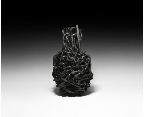 10th-12th century AD. A vessel-shaped mass of iron tools including latchlifter-keys, fish-hooks, nails and other items with c