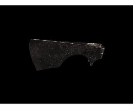 9th-11th century AD. A light iron axehead with triangular-section blade with curved edge and straight chin, triangular spurs 