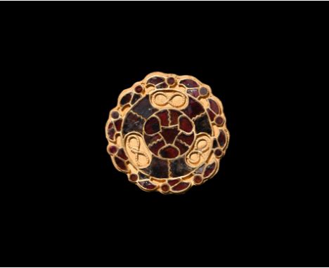 6th-7th century AD. A gold mount comprising a discoid plaque and three attachment loops to the reverse; central panel with th