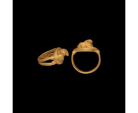 5th-3rd century BC. A gold finger ring comprising two braised filigree bands forming the hoop, ellipsoid bezel with stepped p