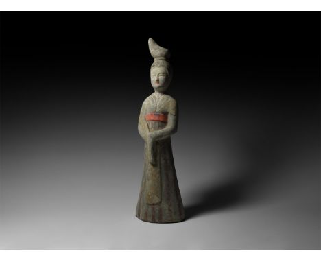 Tang Dynasty, 618-906 AD. An unglazed ceramic figure of a courtly lady in floor-length gown with stole to the upper arms, scu
