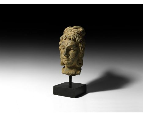 2nd-4th century AD. A carved schist head of Bodhisattva Maitreya with urna to the brow, deep-set eyes, small curled moustache